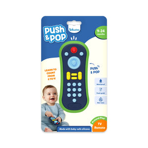 Skillmatics Push & Pop TV Remote baby toy for ages 9–24 months. The packaging shows a navy-blue and green silicone toy with colourful pop buttons designed for sensory play and pretend TV fun. The toy is waterproof, food-grade, and non-toxic. A smiling baby is holding the remote. Text highlights “Learn to count from 0 to 9” and “Made with baby-safe silicone.” A perfect fidget toy for early learning.
