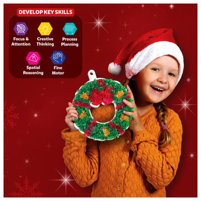 Young girl in Santa hat holding decorated Christmas wreath for Poke-in Art DIY Christmas Decor