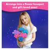 Young girl holding colorful sparkly craft flowers from DIY Delights Poke-in-Art Combo