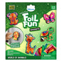 The Foil Fun Magnets “World of Animals” kit packaging features a glittery green background with colorful foil-decorated animal magnets including a dog, butterfly, giraffe, turtle, and lion. A child’s hand places the lion magnet on a metal surface inside a circular inset labeled “Works on all magnetic surfaces.” The box lists 20 foil sheets, 5 magnets, age range 4–12 years, and includes a warning for small parts.