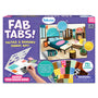 Skillmatics Fab Tabs tactile and sensory fabric art kit box for ages 4–9, featuring a bedroom scene decorated with fabric textures and patterns. The packaging shows peel-and-stick fabric pieces, highlights 75+ fabric textures, a mess-free activity format, and a creative home-design theme.