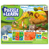 Skillmatics Puzzle & Learn: All About Wild Animals box showing a 25-piece puzzle for ages 3–7. The cover features illustrated wild animals including lions, elephants, giraffes, zebras, rhinos, deer, cheetah, bison, ostrich and more, plus six educational learning boards and a safety warning.