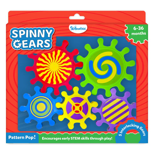 Skillmatics Spinny Gears Pattern Pop toy box on a red background for ages 6–36 months. Five interlocking plastic gears shown: red sunburst, green blue-yellow spiral, blue concentric circles, yellow with purple cross, and purple with yellow stripes. Labels read "5 Interlocking Gears," "Pattern Pop!" and "Encourages early STEM skills through play!"
