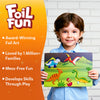 Young boy holding Dinosaur-themed Foil Art Kit from Foil Fun World Of Dinosaurs