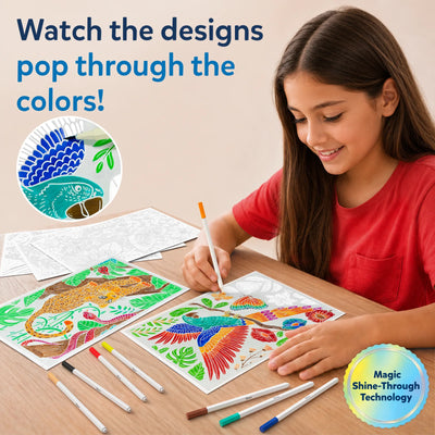 Child sitting at table smiling while using paint-over art markers on illustrated activity sheets, revealing bright colors through hidden patterns; multiple markers laid out on wooden surface and finished colorful animal designs visible beside ongoing coloring activity.