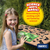 Smiling girl creating glow-in-the-dark animal silhouettes with Magical Sun Art Sun Paper Art Kit