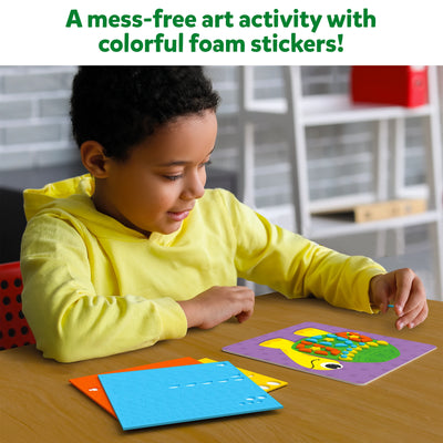 Child creating colorful animal foam sticker art for Fun with Foam Amazing Animals activity