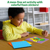 Child creating colorful animal foam sticker art for Fun with Foam Amazing Animals activity