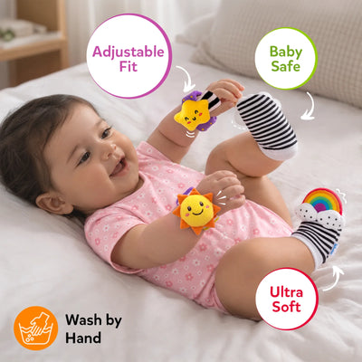 Smiling baby wearing Skillmatics Wriggle & Wonder socks and wristbands on hands and feet, with callouts for adjustable fit, baby safe and ultra soft. A hand-wash icon appears below, highlighting the product’s soft, wearable design for infant sensory play.