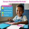 Young child smiling while using Peelies Dessert Chef reusable sticker activity book