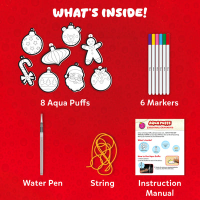 Skillmatics Aqua Puffs Christmas Ornaments kit contents display showing eight uncoloured ornament shapes, six markers, a water pen, string, and instruction manual. Includes designs such as Santa, gingerbread, candy cane, baubles, and teddy bear ready to colour and transform into 3D festive decorations.