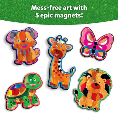 A set of five brightly colored foil-decorated animal magnets is arranged on a white background: a cheerful orange dog with floppy ears, a tall spotted giraffe, a pink and purple butterfly, a multicolored turtle with a smiling face, and a vibrant lion with a striped mane. Above them, the green glittery banner reads “Mess-free art with 5 epic magnets!”