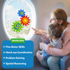 A mother seats a toddler on her lap on an airplane, pointing at three Skillmatics Spinny Gears on the oval window: blue concentric, red sunburst, and green spiral gears interlocked. A blue box lists skills developed: Fine Motor Skills, Hand-eye Coordination, Problem Solving, and Spatial Reasoning. 