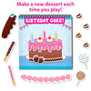 Young child smiling while using Peelies Dessert Chef reusable sticker activity book