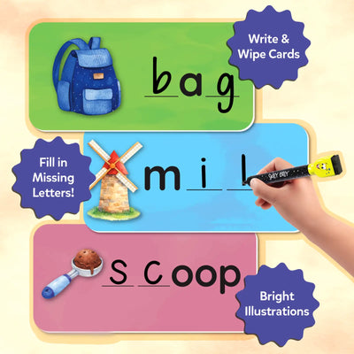 Close-up graphic showing three colorful spelling cards with illustrations: a backpack labeled “bag,” a windmill with missing letters in “mill,” and an ice cream scoop forming “scoop.” A child’s hand writes using a marker. Callouts read “Write & Wipe Cards,” “Fill in Missing Letters,” and “Bright Illustrations,” highlighting interactive phonics learning.