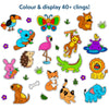 Illustration showing a wide assortment of brightly colored animal-themed static clings on a white background under the heading “Colour & display 40+ clings!” The clings include a butterfly, lion, elephant, crocodile, fox, cat, dog, squirrel, koala, flamingo, toucan, rabbit, hedgehog, monkey, and hippo, along with small leaves, flowers, bones, and grass icons, highlighting variety and creative display options.