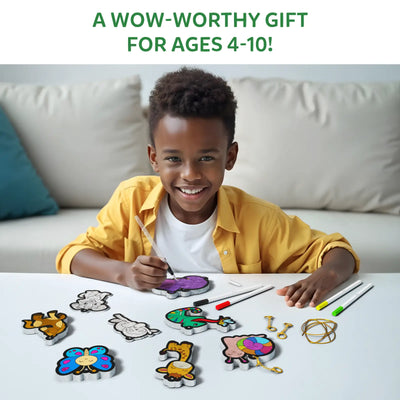 Young boy happily coloring animal and object shapes with Aqua Puffs Animal Friends 3D Art Kit