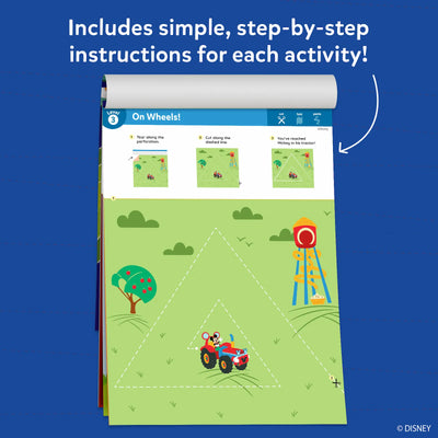 An open activity booklet page shown against a blue background with the heading stating that simple, step-by-step instructions are included for each activity. The visible page is labeled Level 3 and titled “Hello, Toodles!” with illustrated steps showing tearing along perforation lines, cutting dashed shapes, folding circles, and pasting pieces together. Icons for cut, fold, and paste appear at the top, guiding the activity sequence visually.
