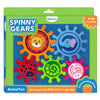 Skillmatics Spinny Gears Animal Fun 5-gear toy box shown at an angle on a green background. Five interlocking gears displayed: orange lion, blue elephant, red ladybug, green caterpillar spiral, and pink rabbit. Labels read 