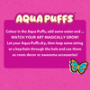 Instruction graphic with Aqua Puffs logo on pink background explaining process: color the Aqua Puffs, add water to watch art grow, let dry, then attach string or keychain to use as room decor or accessories. Includes bold headline and butterfly design example in bottom corner.
