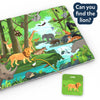 A jungle-themed cloth play mat is shown at an angle with a speech bubble reading “Can you find the lion?” The mat features a forest river scene with a lion, elephant, tiger, crocodile, giraffe, birds, and plants. A curved line points from a green lion card to the matching lion illustration on the mat.