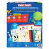 The back view of the Skillmatics Snip Snip box showing a detailed layout of features and contents. Sections highlight key skills such as fine motor development, creative thinking, spatial reasoning, and focus. Illustrations display sample activity pages, two safety scissors, a glue stick, and 25 activities. Additional callouts mention hand-eye coordination, safety standards, age guidance, and certification icons along the bottom.