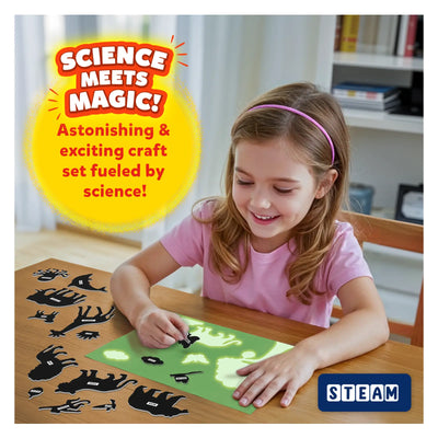 Smiling girl creating glow-in-the-dark animal silhouettes with Magical Sun Art Sun Paper Art Kit