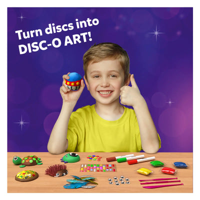 Young boy smiling and holding a colorful spherical Disc-O Art creation for kids ages 4-12