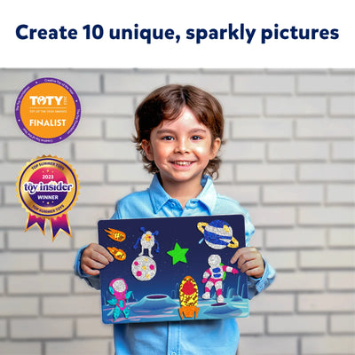 Young child holding a sparkly space-themed art kit from Foil Fun Space Safari Combo