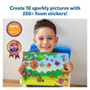 Young boy holding colorful animal sticker art board from Wild & Winged Animal Bundle