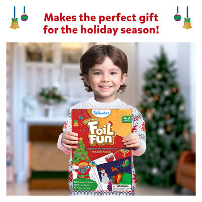 Young child holding a Foil Fun holiday-themed art and craft kit for ages 4-9