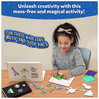Young girl creating glittery stickers with Foil Fun Groovy Beats Magnetic Art Kit