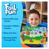 Young boy happily holding colorful foil art kit with bugs and butterflies for kids ages 4-9