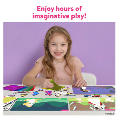 Young girl smiling while playing with Disney Princess magnetic dress-up set from Foil Fun Art Kit