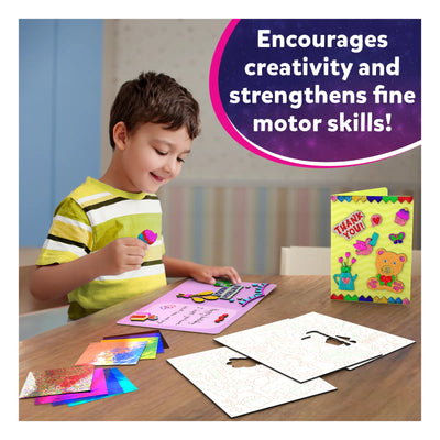 Boy creating art with craft supplies from Foil Fun Card Making Set for ages 4-9