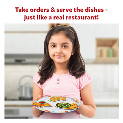 Young girl holding a toy plate with food cutouts from Little Chefs Creative Kit