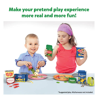 Children playing with pretend food and cooking accessories from Lets Make Pasta toy set
