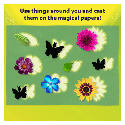 Colorful flowers leaves and butterfly cutouts with glowing outlines for magical paper art