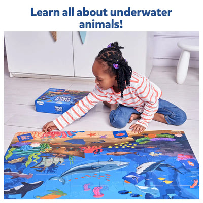 Child assembling a large ocean-themed educational floor puzzle from Piece & Play Underwater Animals collection