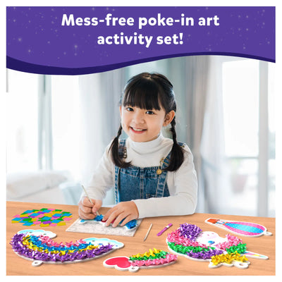 Smiling child creating colorful unicorn and rainbow art with Poke-in Art Magical Unicorn Dream Decor