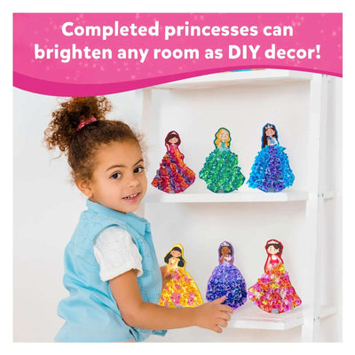 Young girl proudly displaying six colorful princess craft dolls from DIY Delights Poke-in-Art Combo
