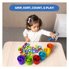 Young child sorting and counting colorful geometric shapes with matching cups in Playful Colours & Patterns Bundle