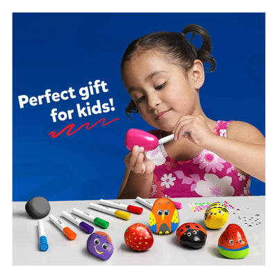 Young girl painting decorative rocks with colorful markers using a Rock Painting Kit