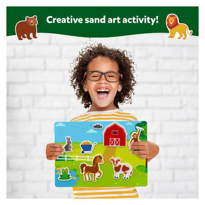 Child smiling with farm-themed magnetic sand art board from Sand-Tastic Art Amazing Animals