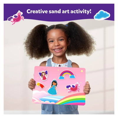 Young girl holding pink fairy tale-themed sand art board from Sand-Tastic Art Unicorns & Princesses