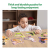 Child assembling animal-shaped puzzles from Step By Step Puzzle Combo for ages 3+