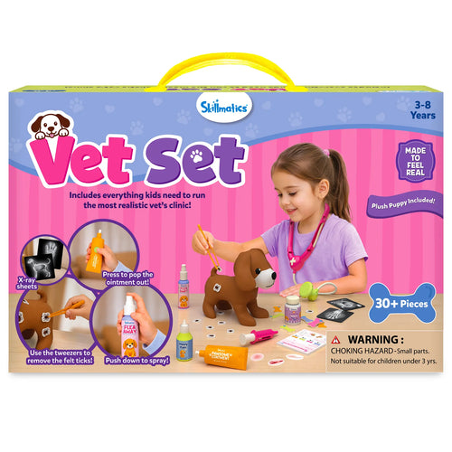 Skillmatics Vet Set toy packaging with a pink carry case design and large display windows. The box highlights 30+ pieces for ages 3–8, includes a realistic vet clinic playset with spray bottle, felt ticks, X-ray sheets, and plush puppy, plus carry handle and safety warning.